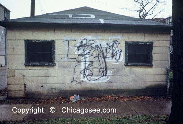 garage with gang graffiti scrawl, Chicago