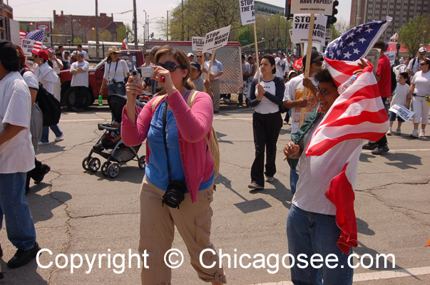 Woman photographer at Immigration March, Chicago, 2007