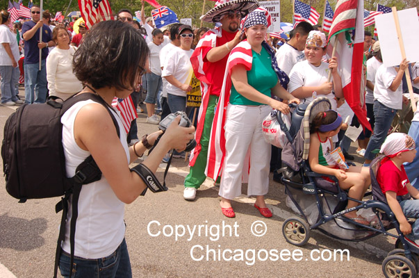 Woman photographer, Immigration Reform March, Chicago, May 1, 2007