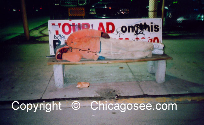 Homeless man sleeping on bench, Chicago, 2007