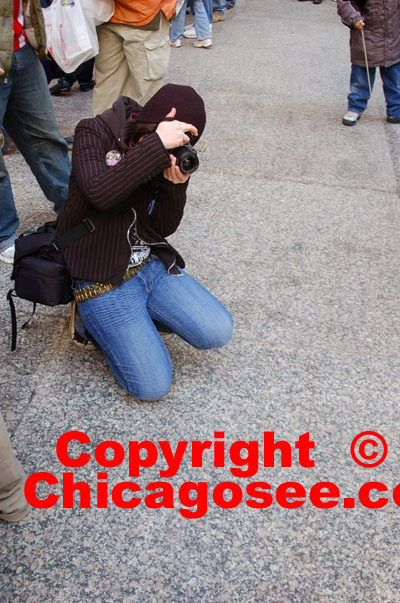 Woman photographer at Chicago rally, 2007