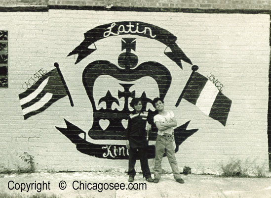 Latin King wall mural, Chicago. kids pose in front of proudly