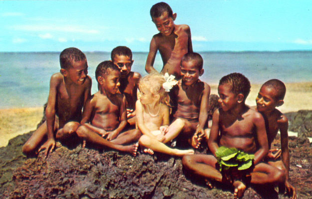 Fijian boys surround a lily white girl, cute postcard view