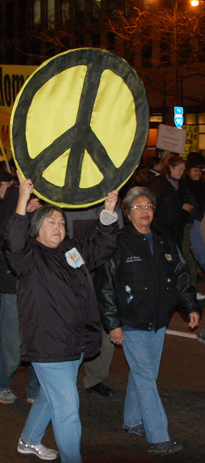 Peace sign carried in Chicago demonstration, 2007