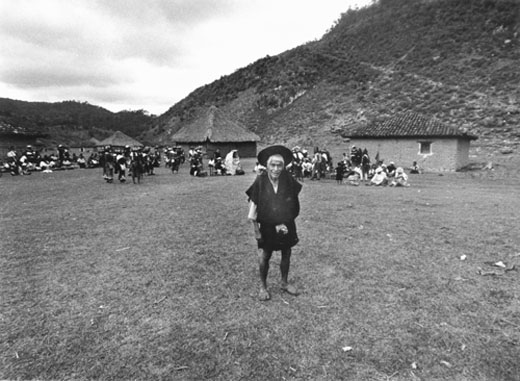 Old man standing in village plaza, Tenejapa, Chiapas, Mexico