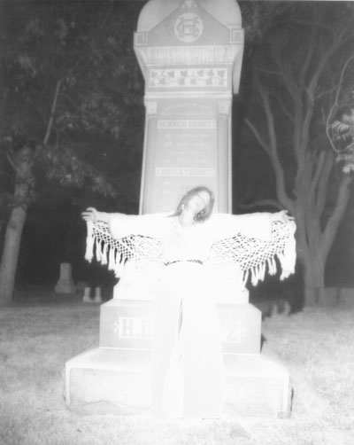 Ghostly Cemetery night of woman Christ-like