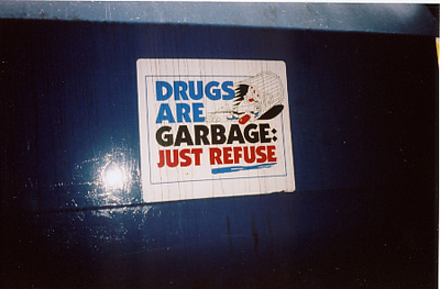 "Drugs are Garbage," Chicago sign on a Dumpster, ironic what is junk?