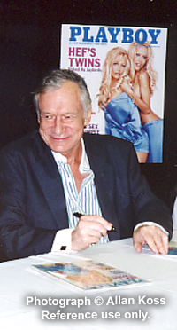 Hugh Hefner signing autographs with two girlfriend Playboy cover