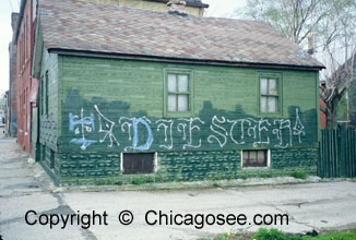 Chicago house with grafitti on side, 1983