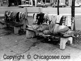 Homeless sleeping on a public bench, Chicago
