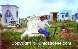 Mexican cemetery caretaker posing for camera
