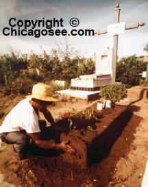 Mexican grave maker prepares the final rest