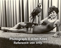 Model posing with a parrot, Chicago, 1963