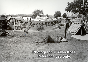 Woodstock, man sleeping under Che Guevara banner, 1969